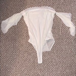 Cream colored off the shoulder body suit